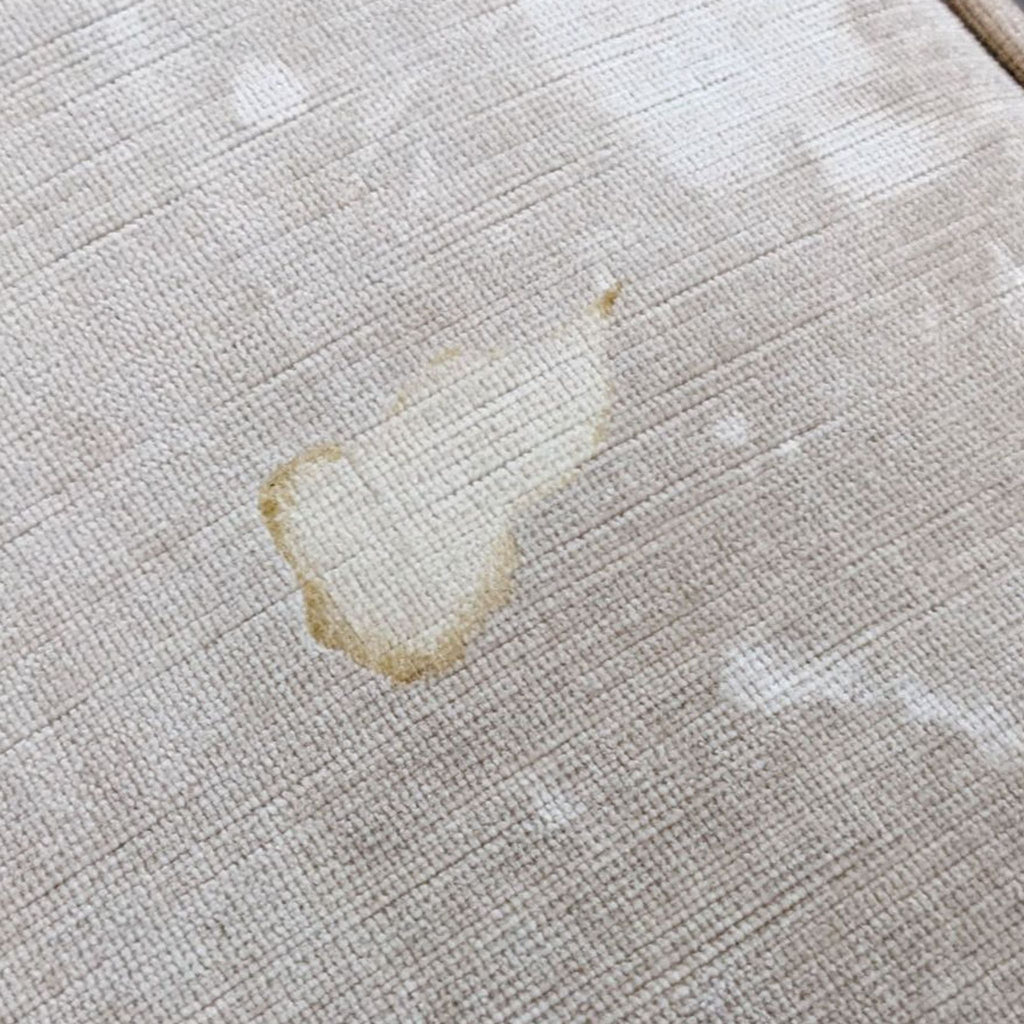 Close-up of a stain on the Z Gallerie sofa's velvet upholstery.