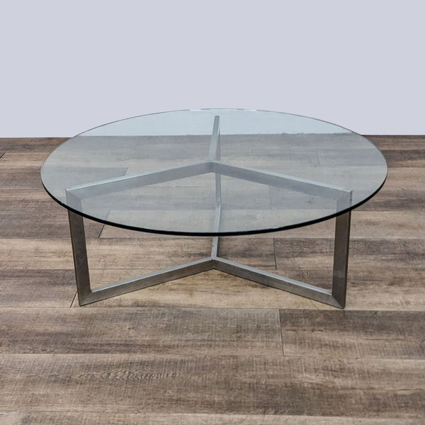 Room & Board coffee table with Y-shaped base and glass top.