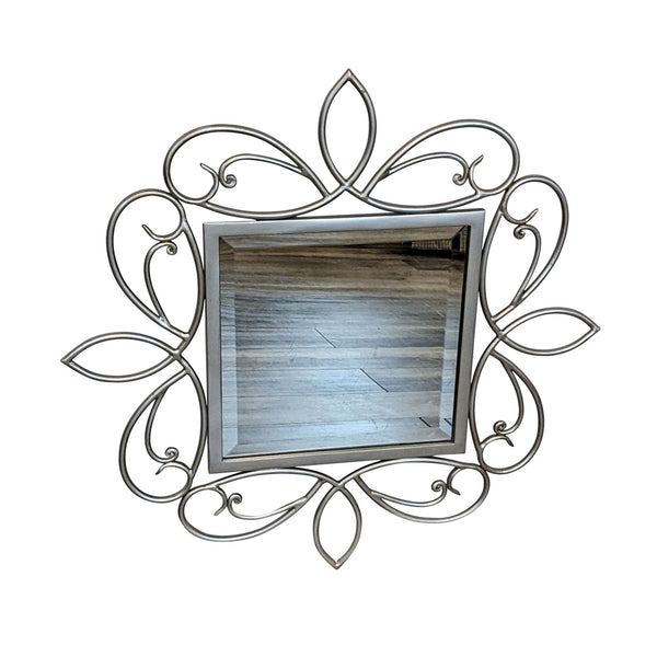 1. Beveled wall mirror with ornate silver metal scrollwork frame by Pacific Coast Lighting.
