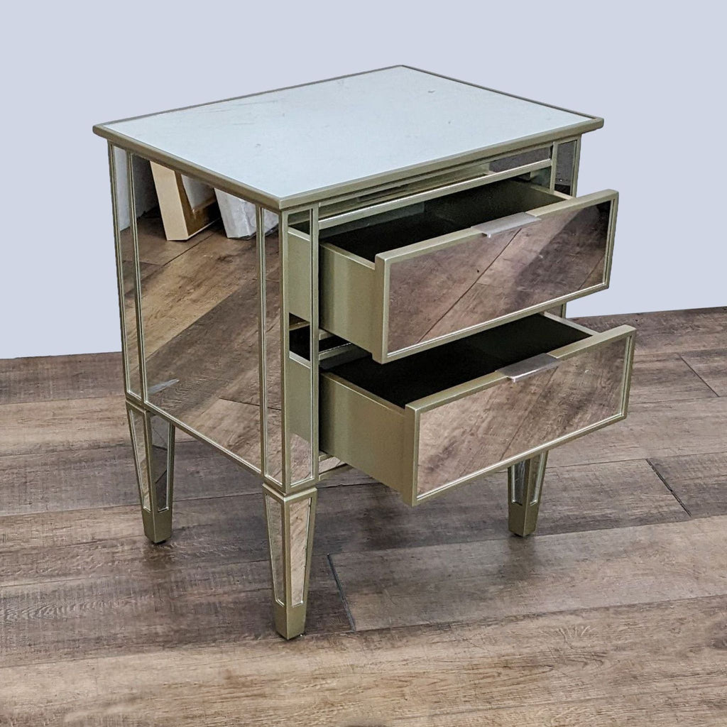 Side view of mirrored end table with open drawers and reflective surfaces.