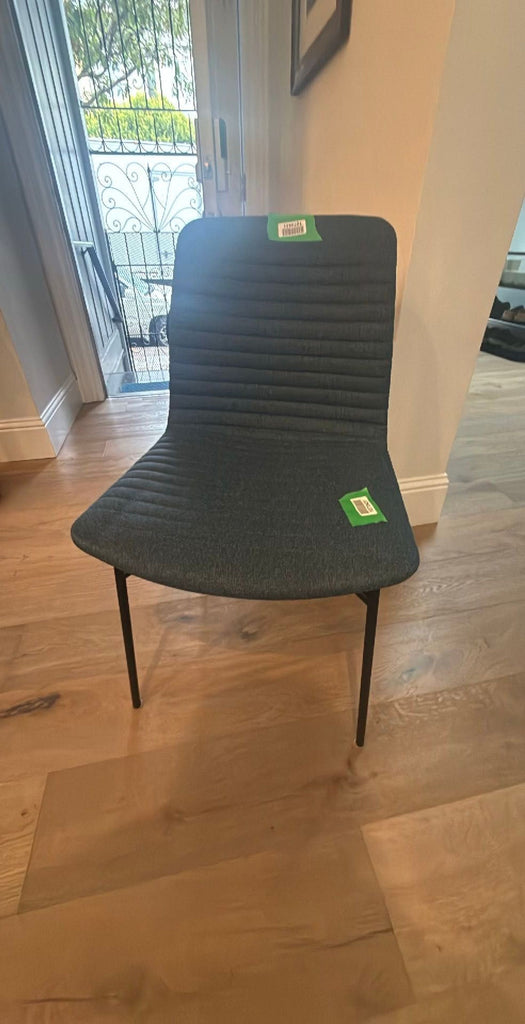 2. Contemporary dining chair by Room & Board, featuring a simple yet elegant design.