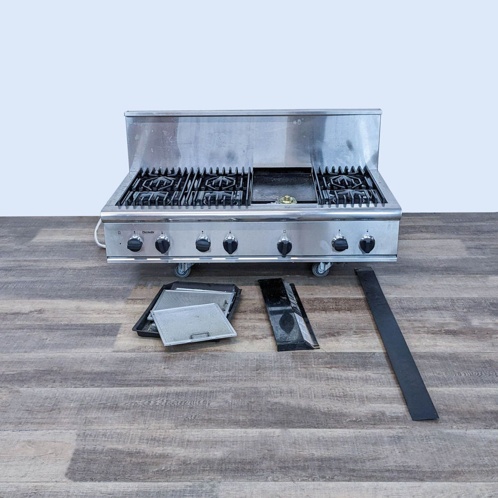 2. Thermador Gas Range with accessories like a griddle and burner covers, showcasing its flexibility and professional design.