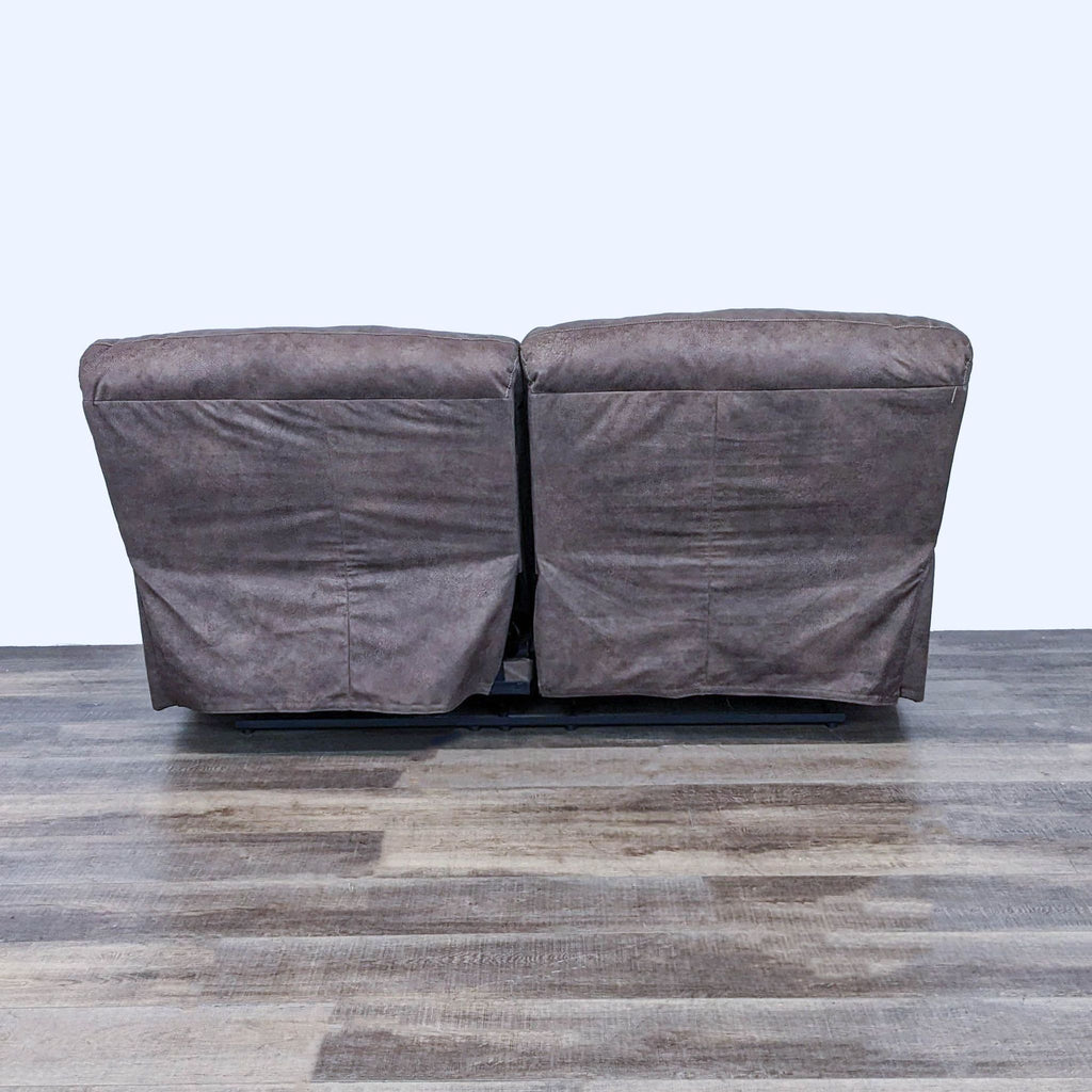 3. Back view of Bolzano loveseat by Ashley Furniture, coffee brown upholstery, highlighting compact design and structure.