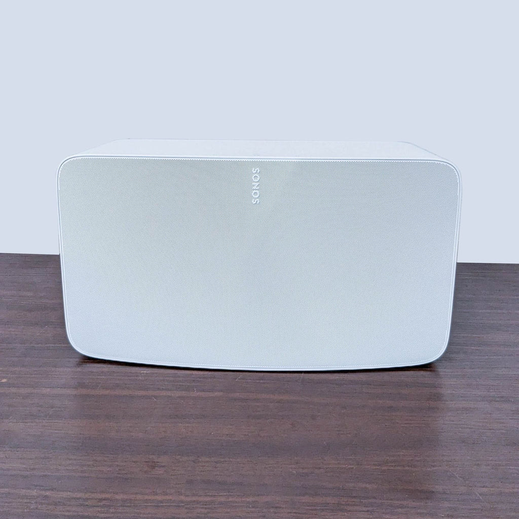 Sonos wireless speaker in white, offering seamless integration and rich audio quality.
