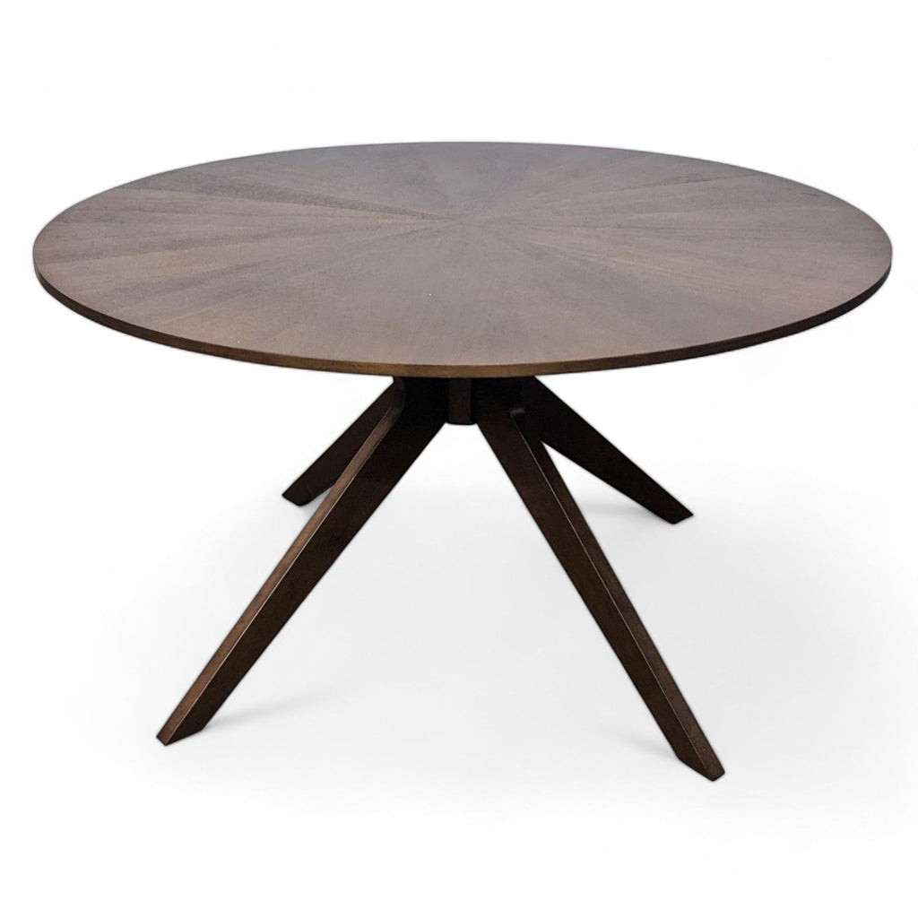 Conan Dining Table by Article with sunburst veneer top and sculptural wood base.