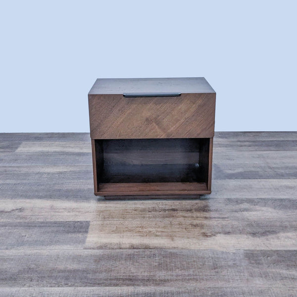 Article brand veneered wood end table with closed drawer and metal handle, on wood floor.