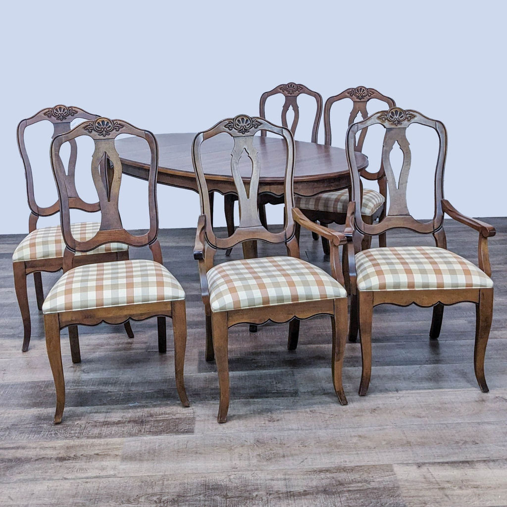 1. Ethan Allen French provincial dining set with one armchair and five side chairs, featuring scalloped apron and Queen Anne legs.
