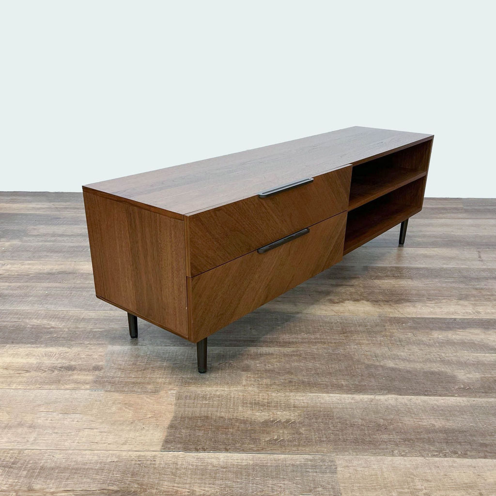 Modern walnut veneered entertainment unit from Article with chevron grain, drawer partially open to show inside.