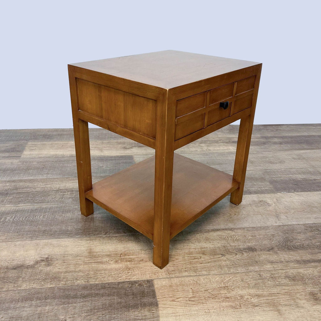 Wooden end table by Crate & Barrel, featuring a drawer and a bottom shelf.