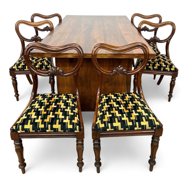 1. "Reperch 7-piece dining set with a solid wood rectangular table and six chairs featuring intricate back carvings and geometric fabric cushions."