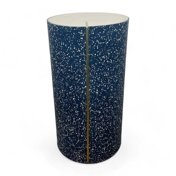 Reperch brand blue terrazzo patterned cylindrical side table on a white background.
