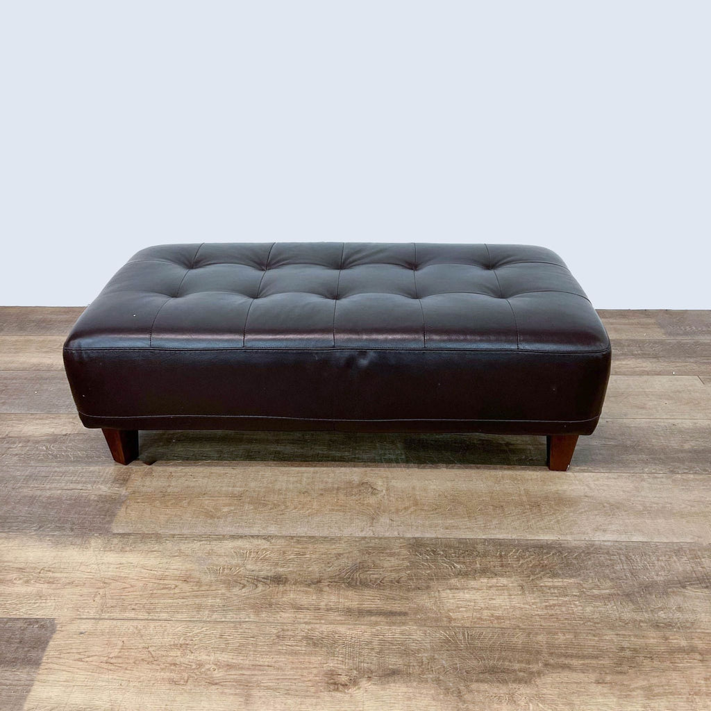 2. Tufted top Italian leather 48" ottoman by Chateau d'Ax, showcasing classic brown color and sturdy wooden legs.