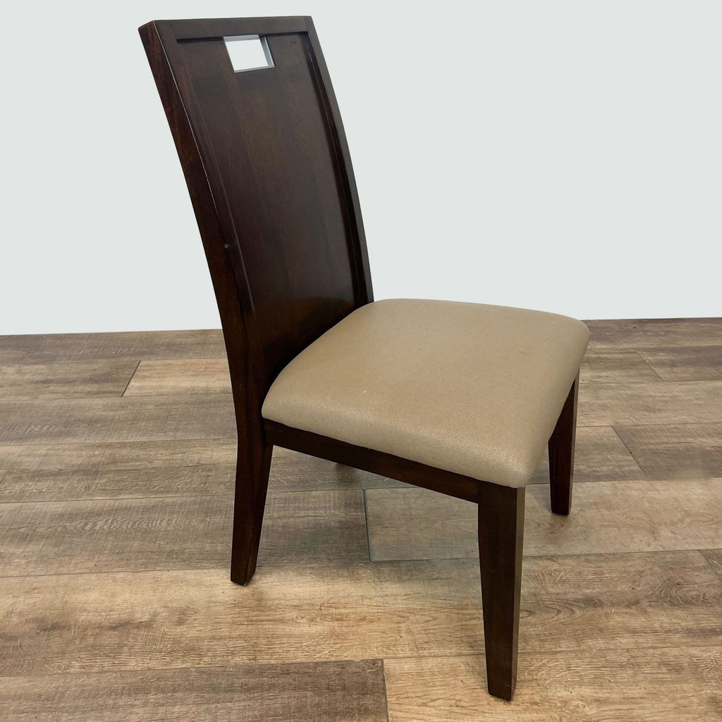 Transitional dining chair by Acme Furniture showcasing a wood frame in dark finish and a cushioned seat, angled view.