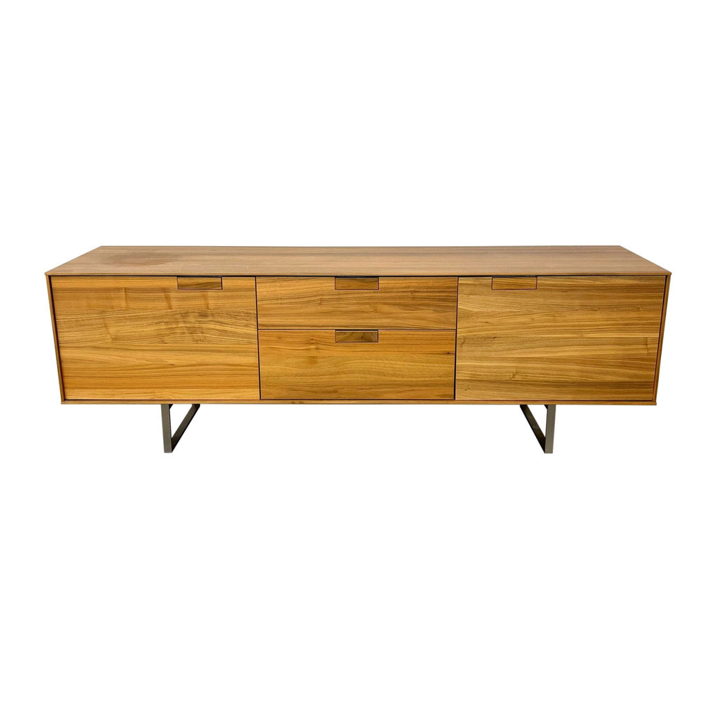 Blu Dot brand entertainment center featuring walnut veneer and stainless steel legs against a white background.
