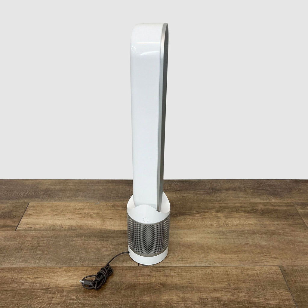 3. Futuristic white Dyson bladeless fan with a power cord, highlighting efficient air circulation and quiet operation.