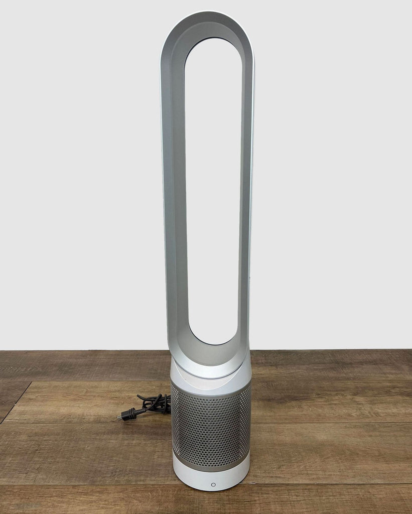 2. Modern Dyson bladeless fan with detachable cord on wood flooring, showcasing portability and easy cleaning.