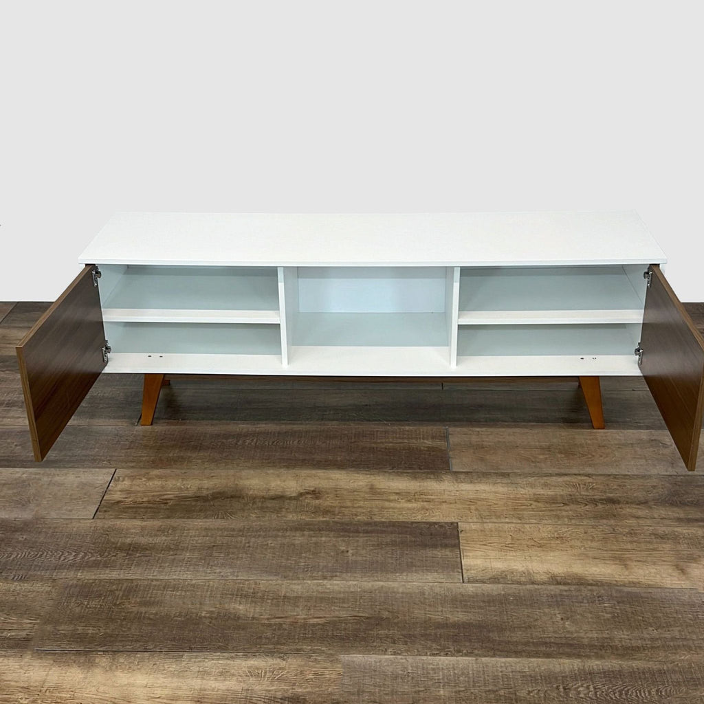 Interior view of Mid-Century Modern entertainment center by Reperch with open shelving units.