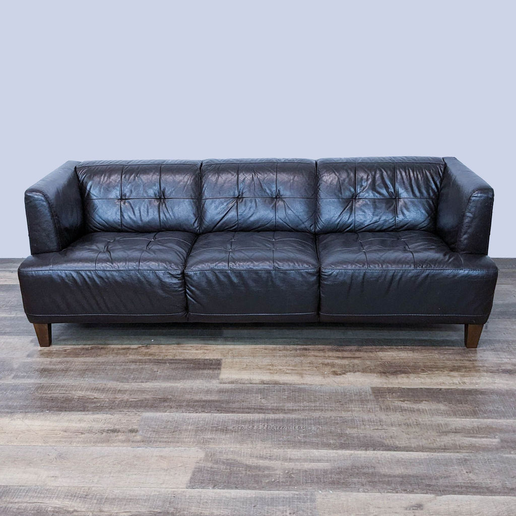 Front view of a Chateau d'Ax 3-seat leather sofa with tufted cushions in brown.