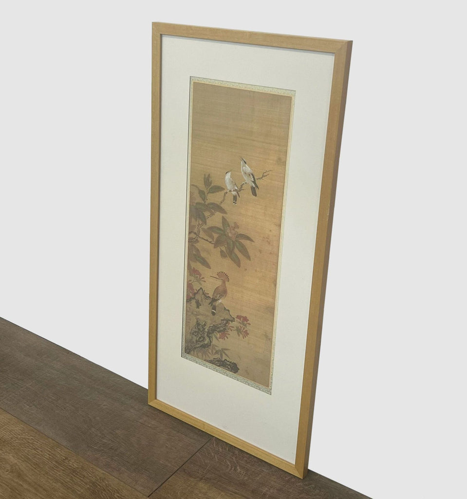 3. Framed and matted Reperch print showing a serene nature scene with birds, resting on a wooden floor against a wall.