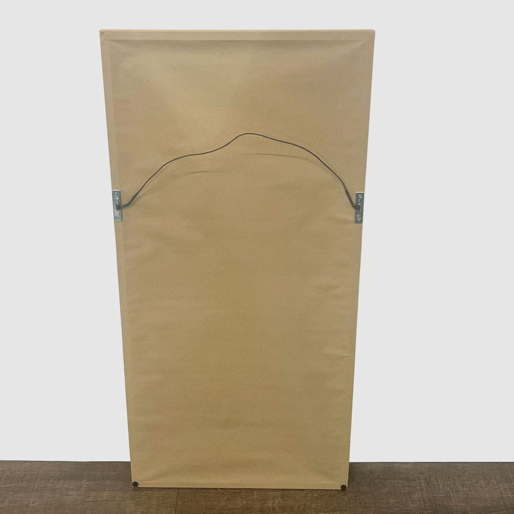 3. "Back view of a Reperch framed artwork showing brown paper backing and wire for hanging."