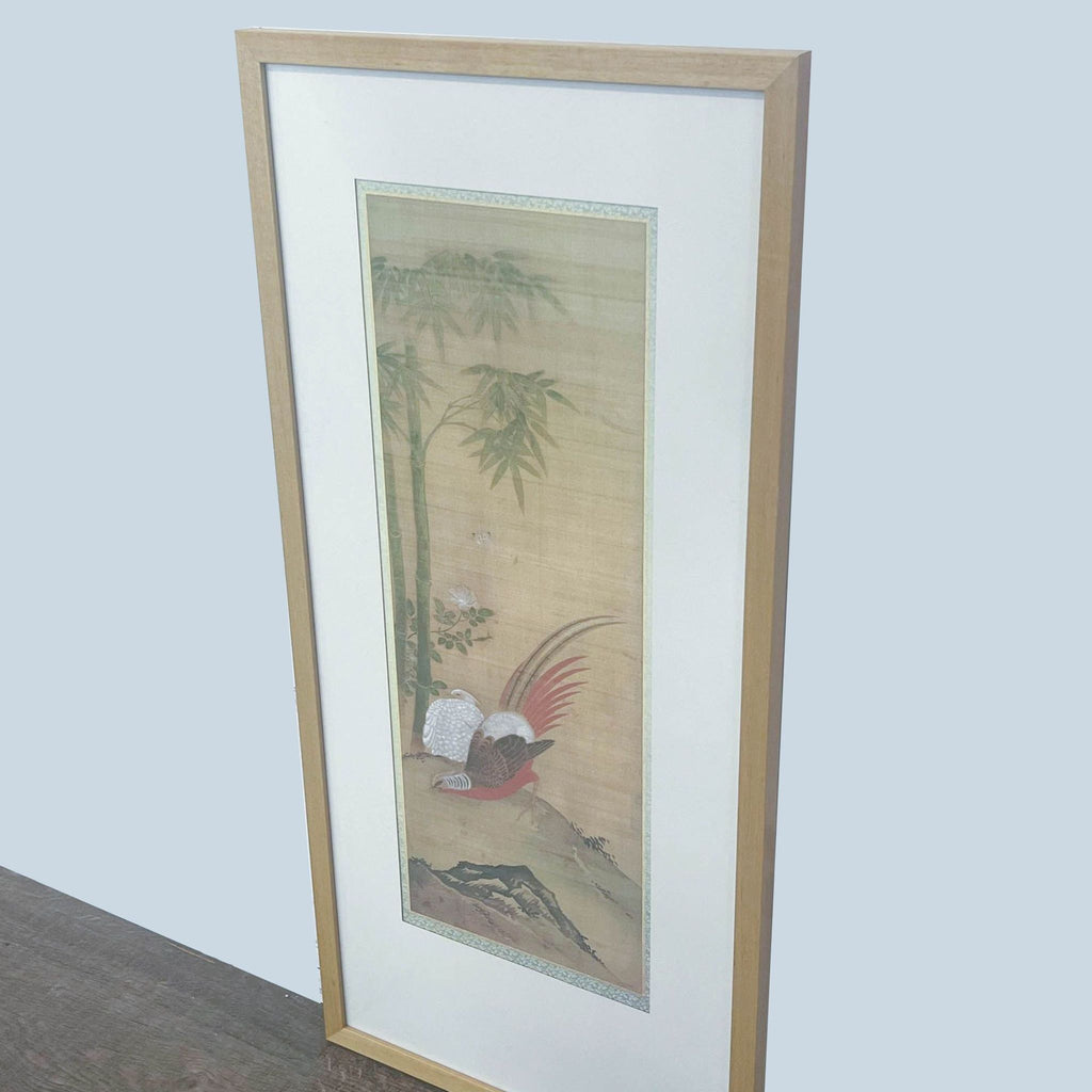 2. "Elegant Reperch nature art print with a bird motif, encased in a wood frame, standing on a wooden surface."