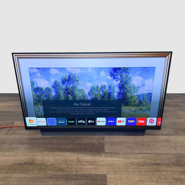 Artistic LG TV with streaming apps, framed like artwork.  