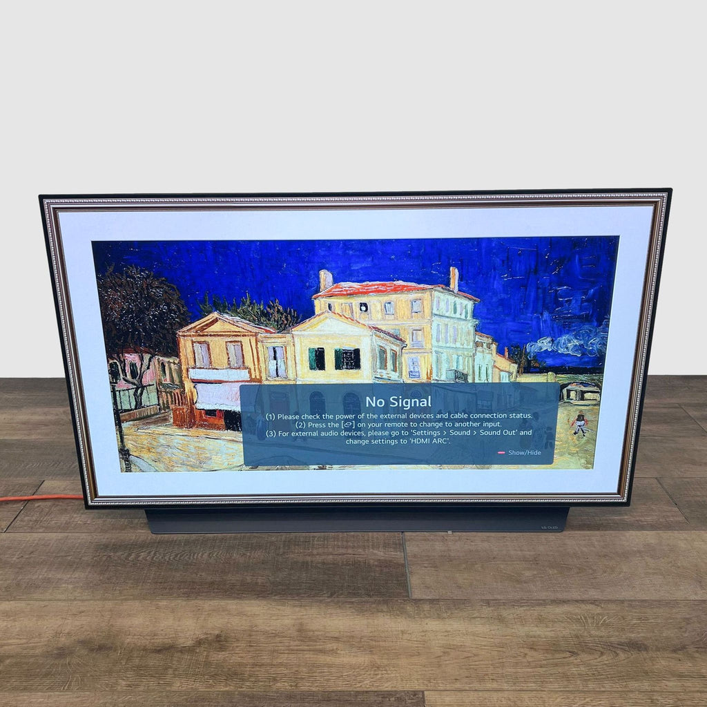 LG TV displaying no signal with an art mode frame.  