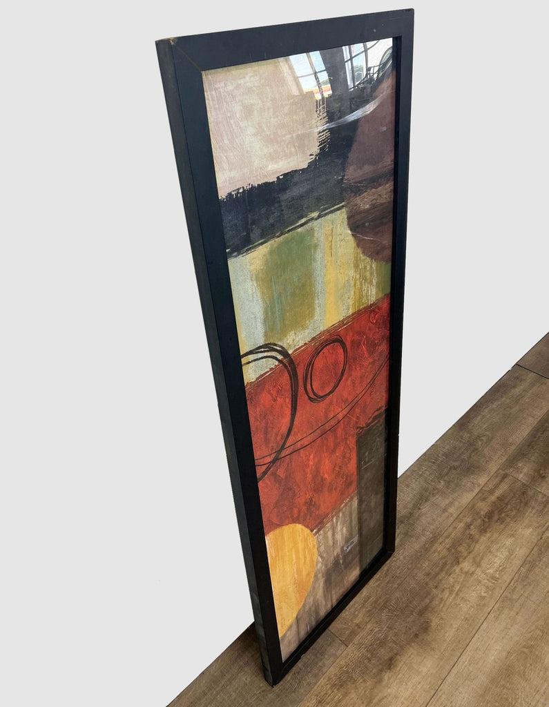 Brent Nelson's "Within Reason" print from Z Gallerie, featuring abstract shapes in red and gold, displayed in a black frame.