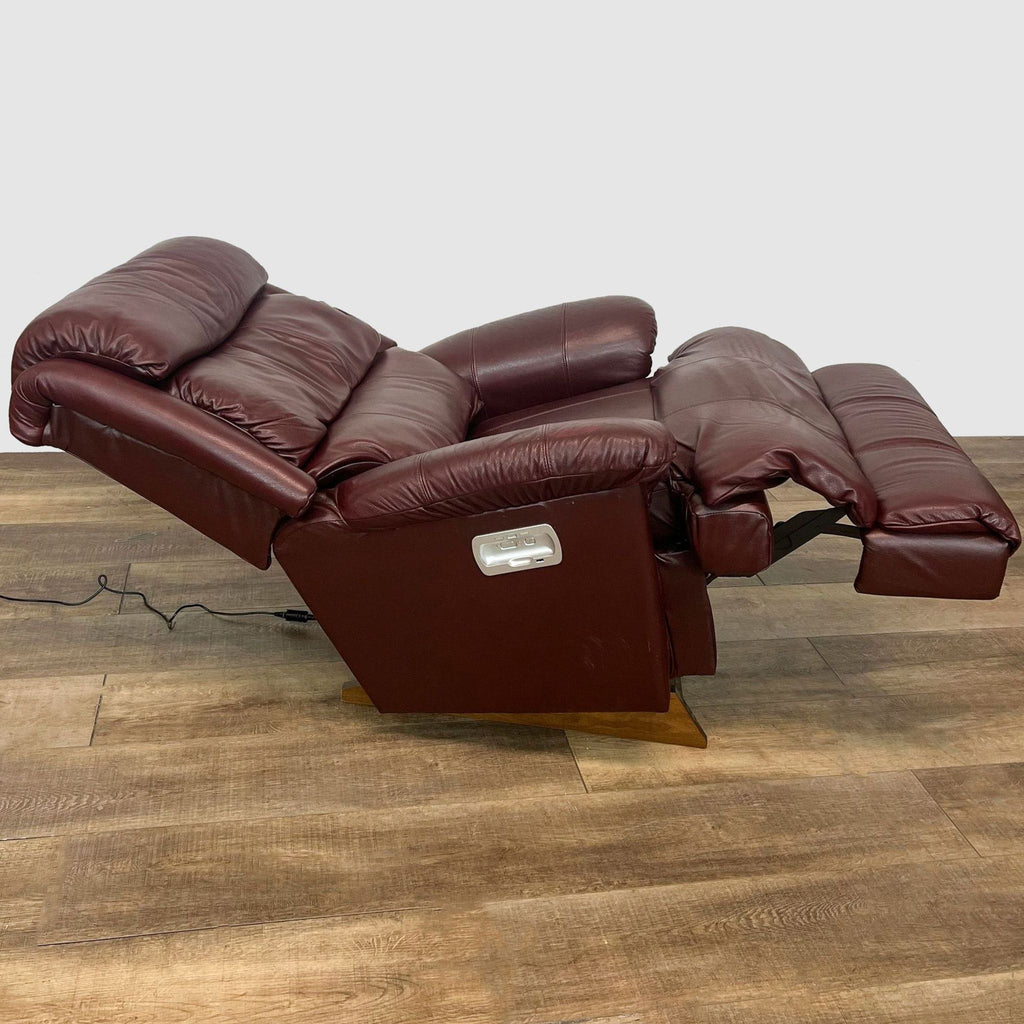 La-Z-Boy recliner showcasing fully reclined position with extended footrest and headrest on a wood floor.