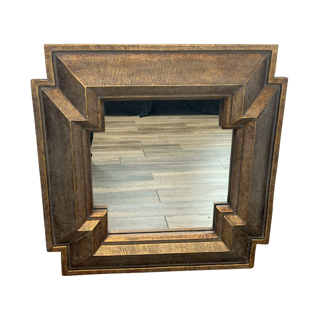1. "Caesar mirror with geometric wooden frame, inset glass by Classique Collection, on a wooden floor."