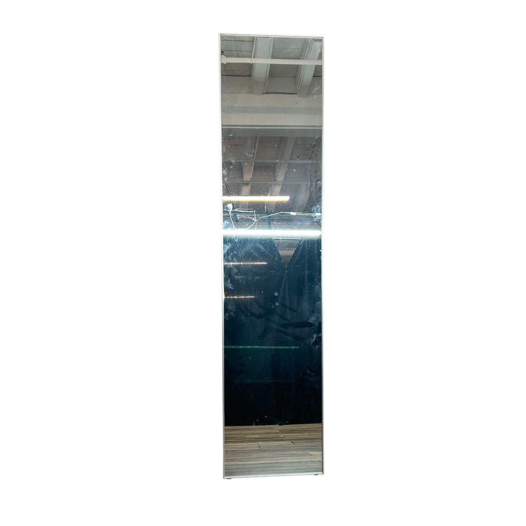 Infinity mirror with slim aluminum frame, standing upright on a wooden floor.