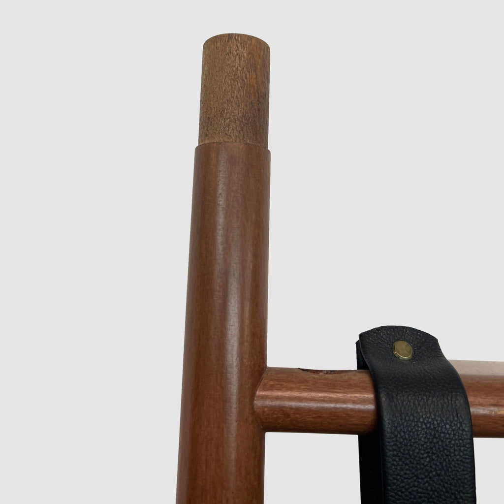 Close-up of the wooden frame and leather strap detailing on the Beau mirror by Article.