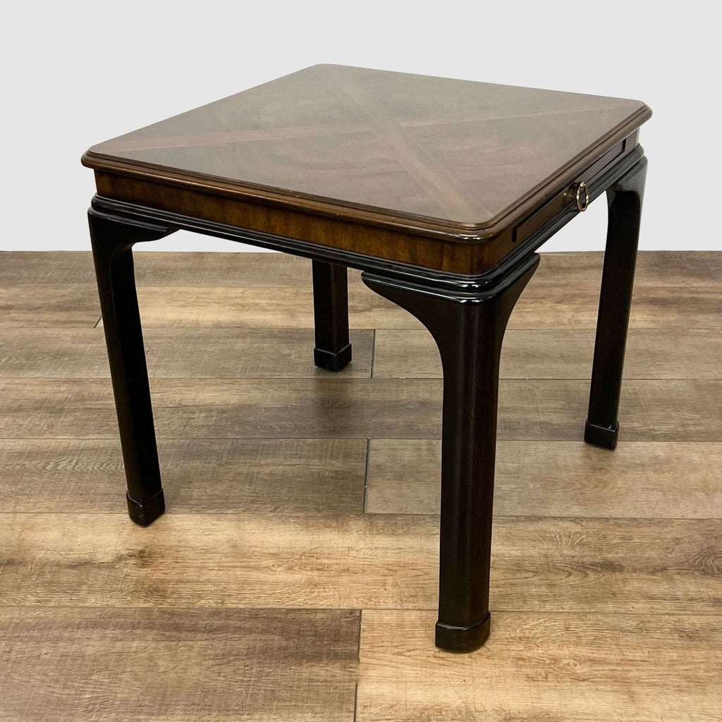 3. Elegant Reperch end table with tapered legs and wood inlay design on top, displayed against a neutral floor.
