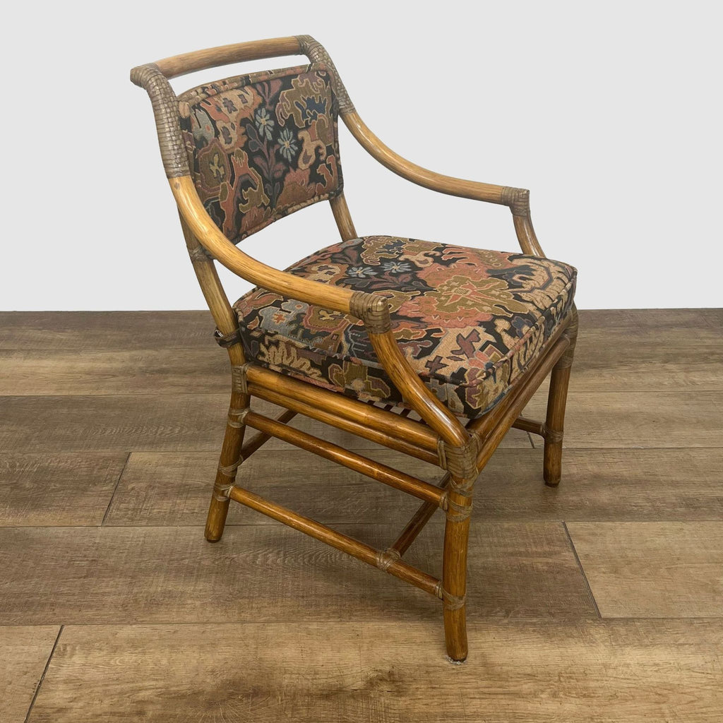 Bamboo-framed dining armchair by McGuire, featuring a cushioned back and seat.