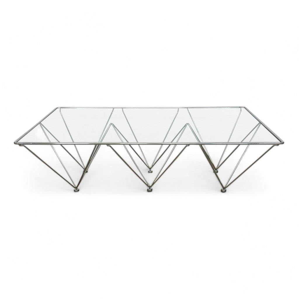 Reperch brand coffee table with a geometric metal base and clear glass top.