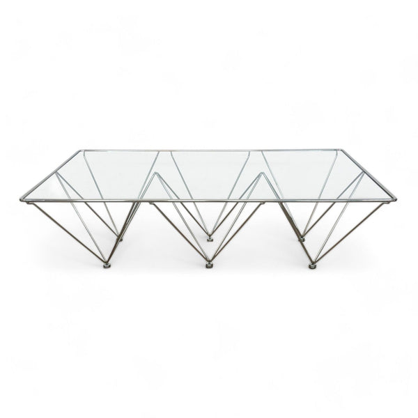 Reperch brand coffee table with a geometric metal base and clear glass top.