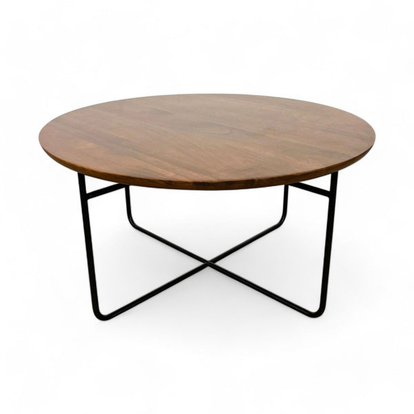 AllModern Wadsworth coffee table with round walnut top and matte black metal base, isolated on white.