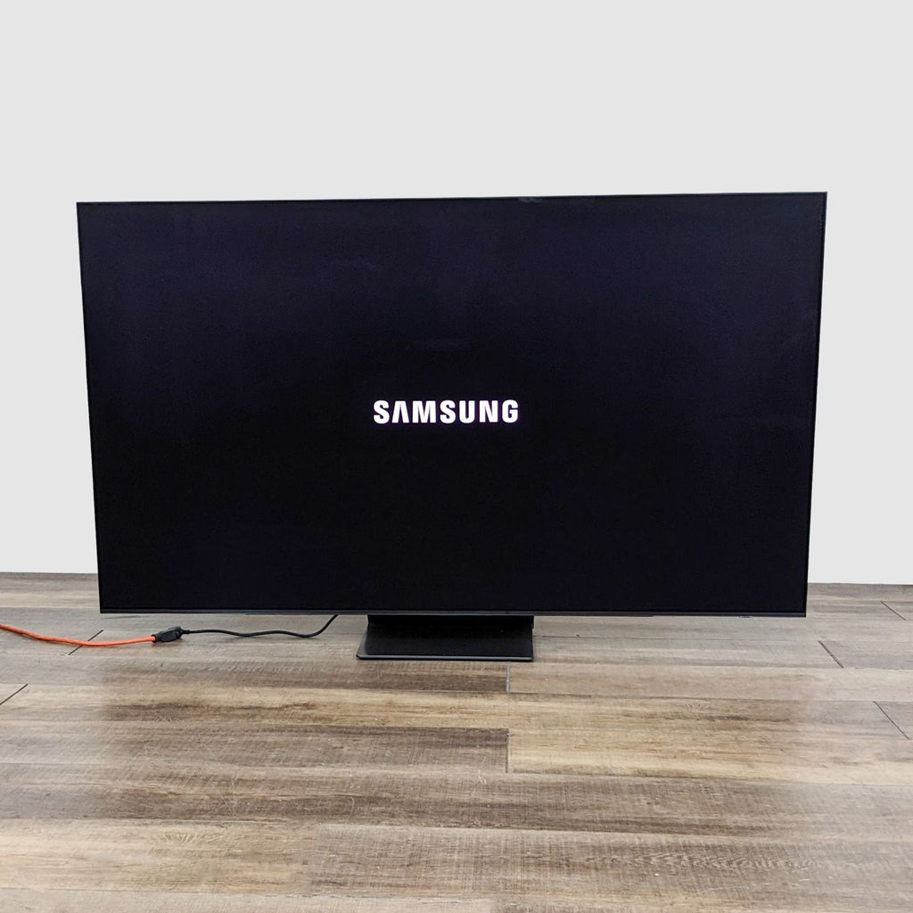 Stylish Samsung TV with a minimalist design and the brand logo onscreen, illustrating its modern look and functionality.