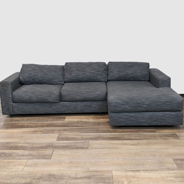 1. West Elm Urban sectional sofa in gray tweed fabric, showcasing a modern design with a chaise on wooden flooring.