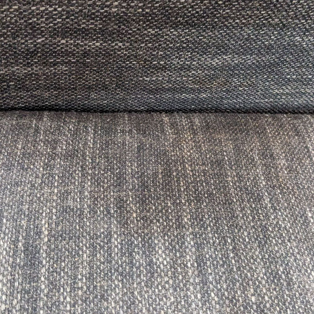 3. Close-up of gray tweed fabric on West Elm Urban sectional, highlighting the texture and weave of the material.