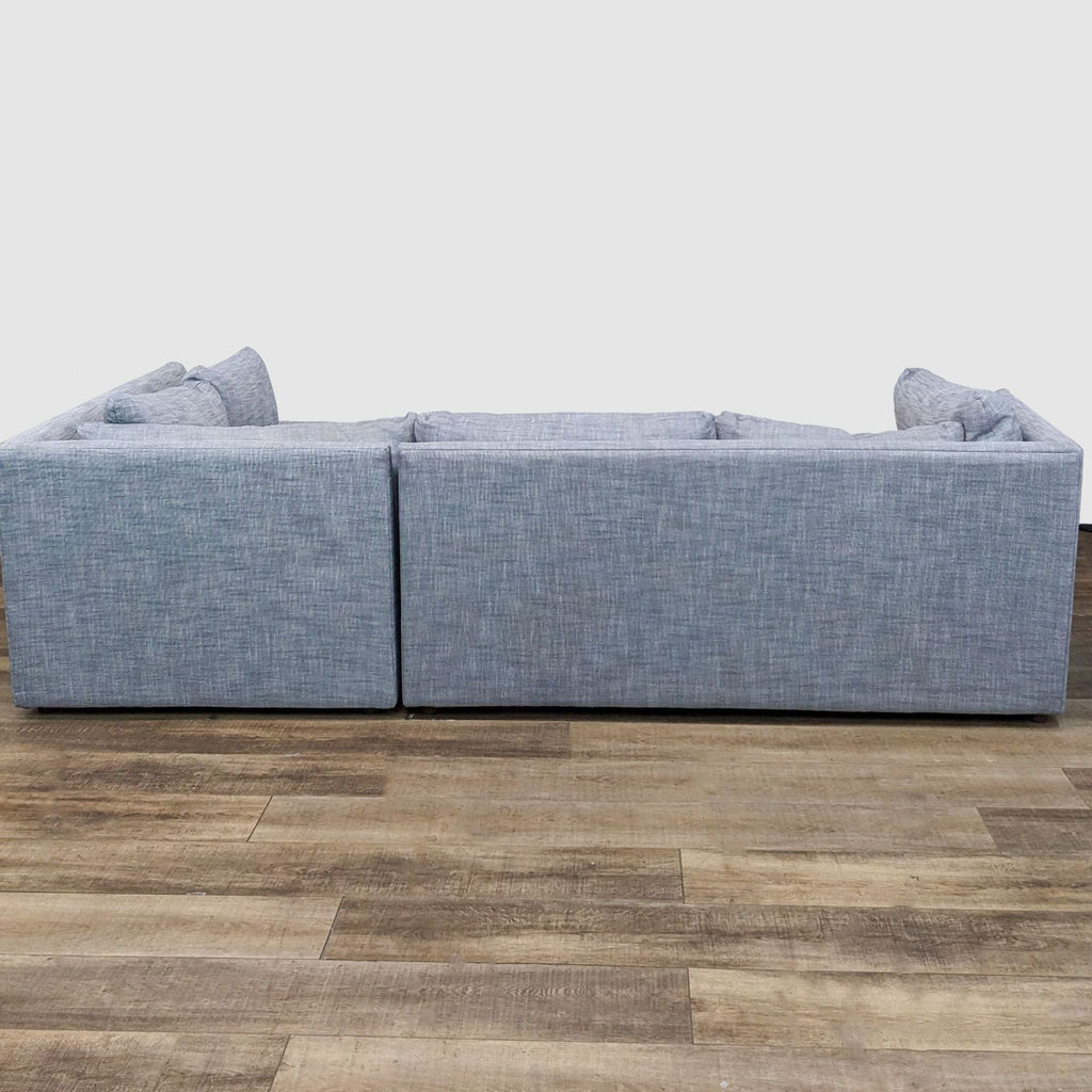Contemporary West Elm Shelter sectional viewed from the side, showing durable graphite yarn dyed linen upholstery.