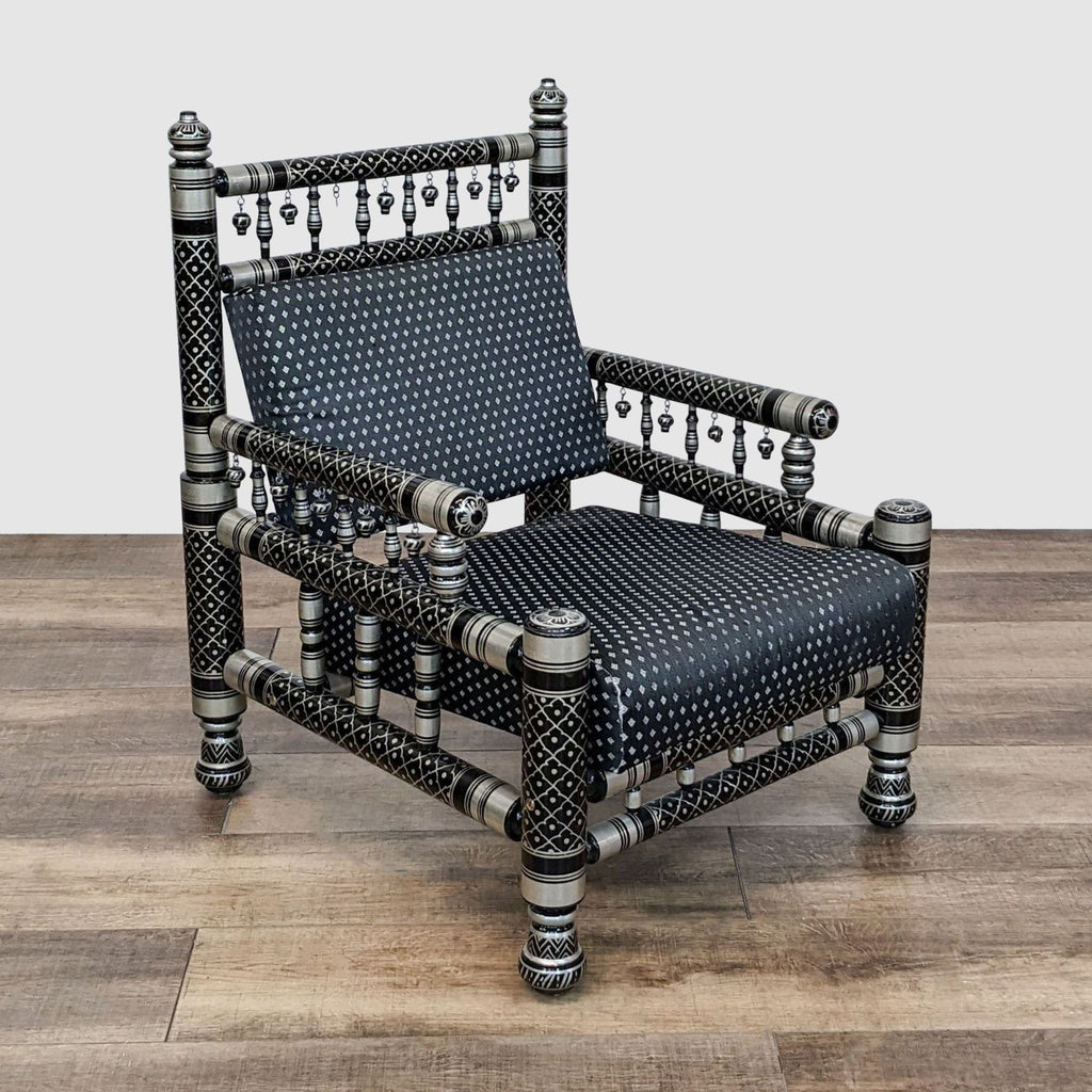 2. Reperch branded Sankheda chair in a room setting, featuring bold black and silver lacquered design with a distinctive spindle frame structure.