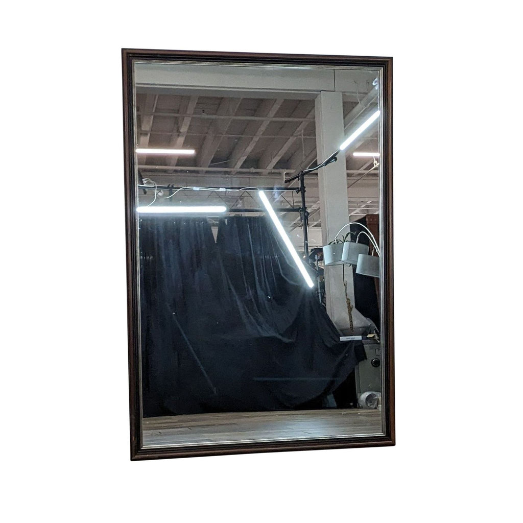 Classic full-length mirror with dark frame and antique gold trim.