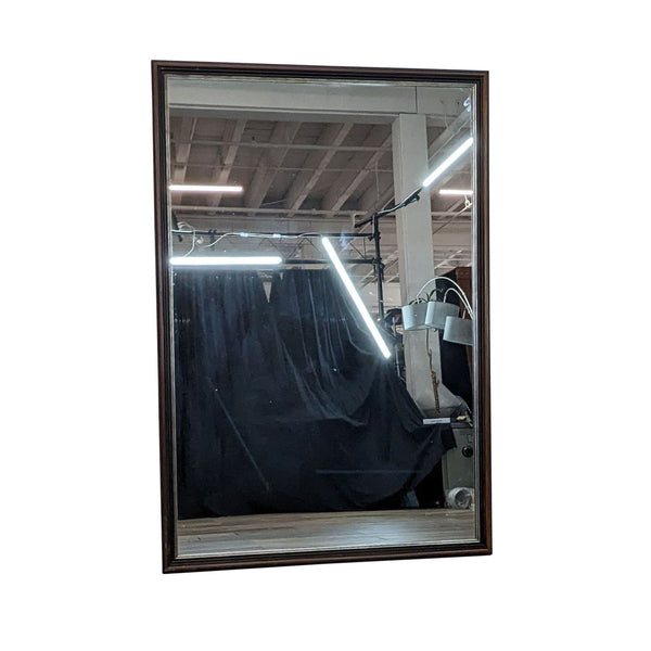 Classic full-length mirror with dark frame and antique gold trim.