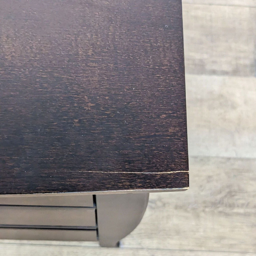 3. Close-up of the wood grain texture on the top surface of a Baronet Furniture end table.