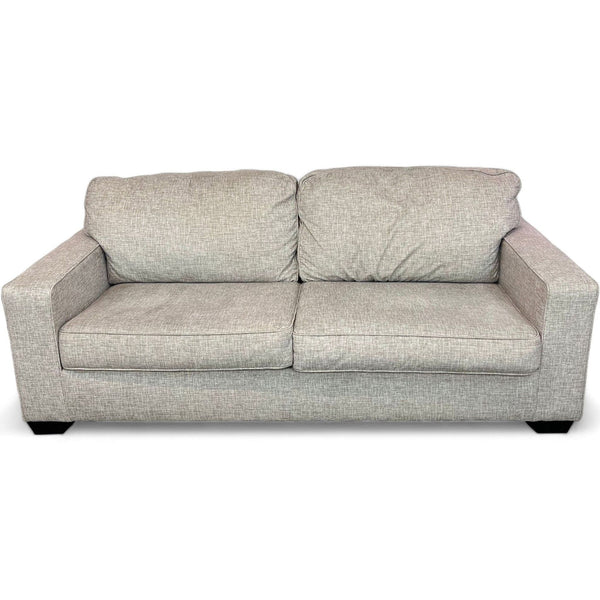 1. Ashley Furniture Termoli loveseat with contemporary design, grey fabric, and dark block feet, isolated on a white background.