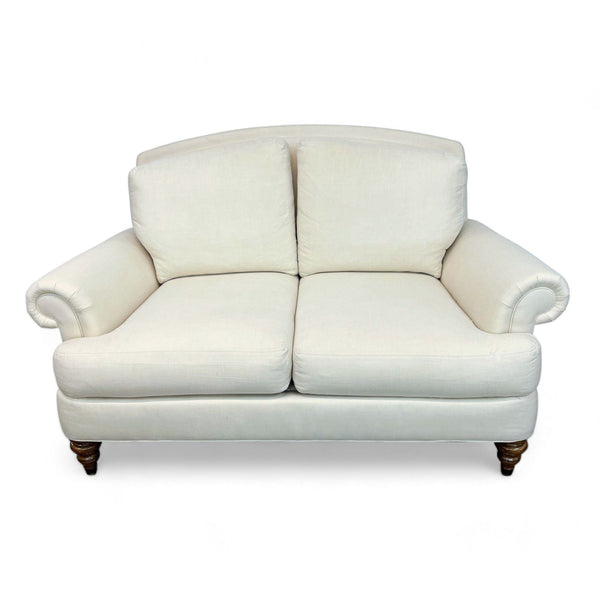 Ethan Allen loveseat with rolled arms and white upholstery on a white background.