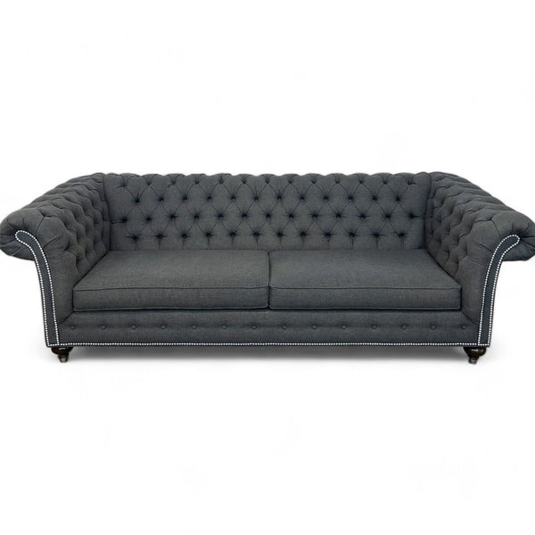 1. The Mansfield sofa by Ethan Allen with deep diamond tufting, high rolled arms, and nailhead trim, viewed frontally.