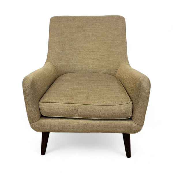 1. A Room & Board Quinn accent chair with textured upholstery and tapered wooden legs against a white background.