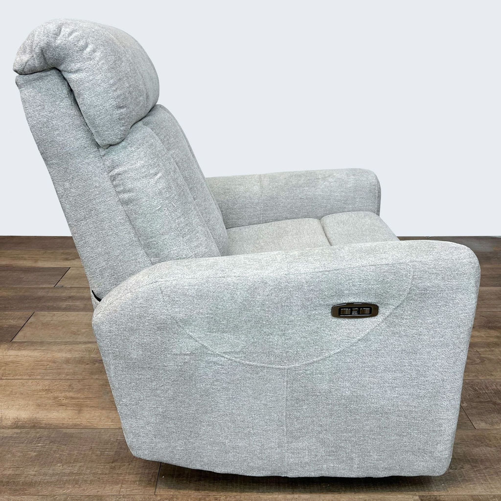 3. Rear view of a Living Spaces Halo II power recliner, showcasing the grey fabric and built-in USB port on the side.
